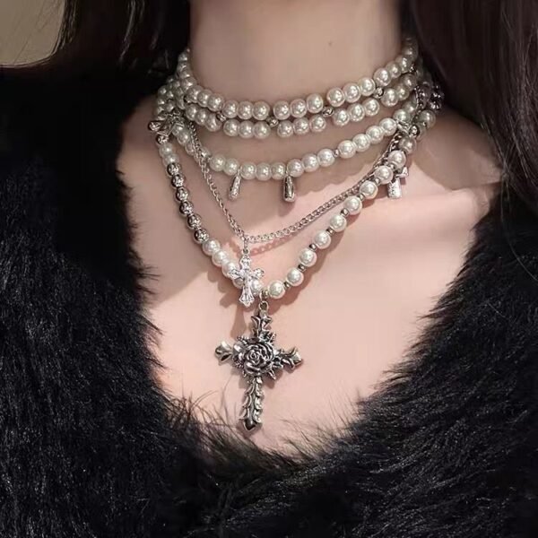 Heavy Industry Cross Pearl Necklace A niche-designed piece for edgy style lovers, featuring a clavicle-grazing design with multiple layers, wearable as a choker or neck chain.